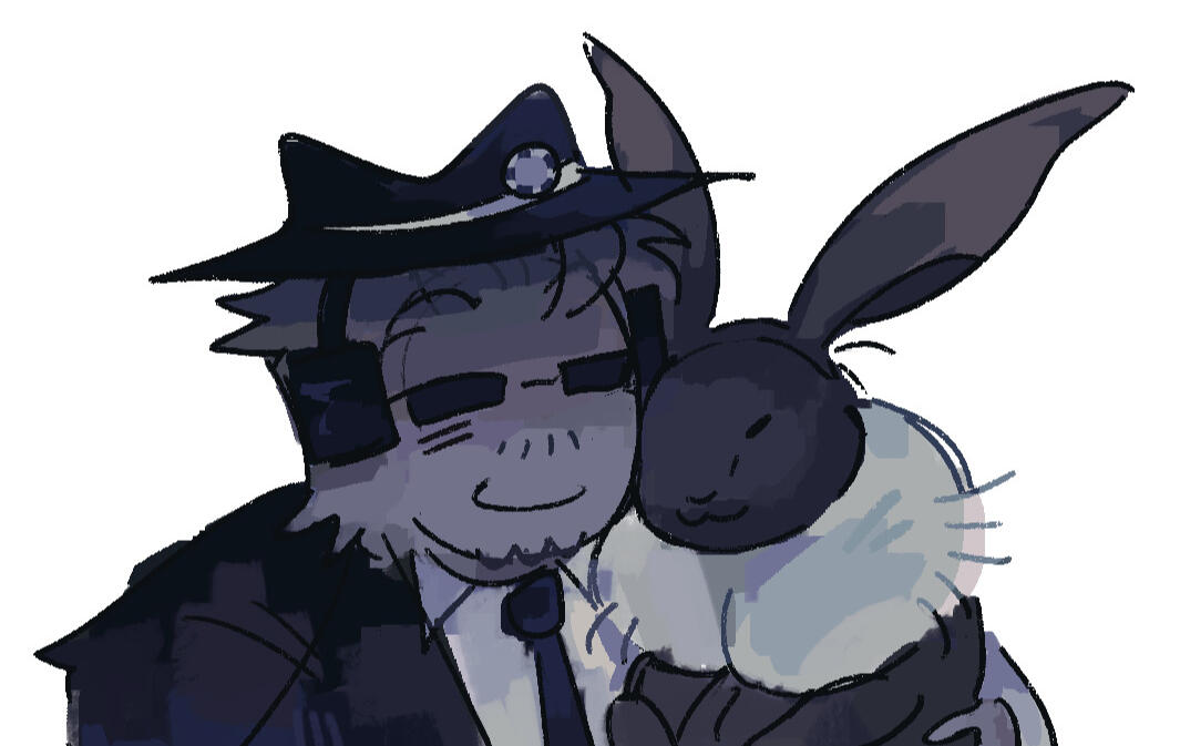 Chance and spade, spade is snuggling up to chance, who has a smile on his face.